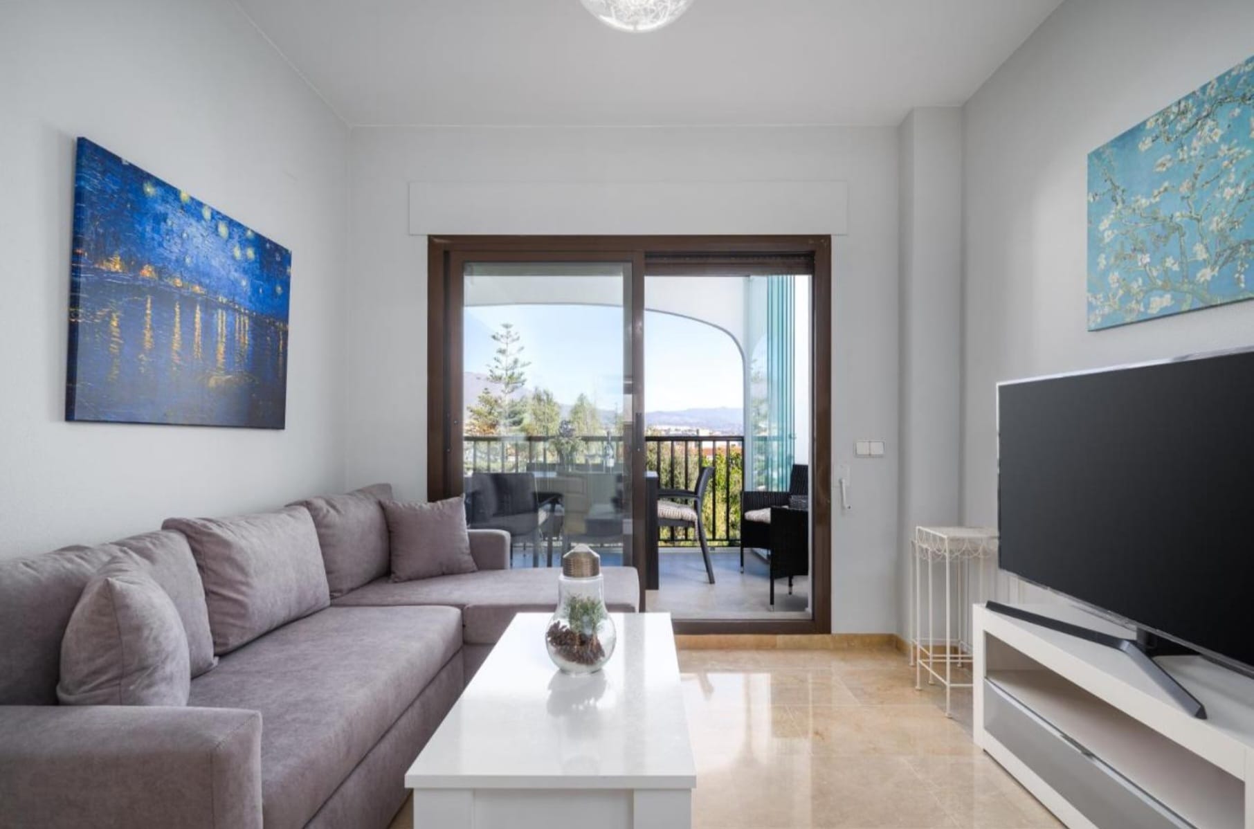 Light-filled living room in Marina de la Duquesa holiday rental apartment